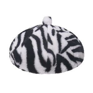 Winter faux fur beret hat featuring a stylish black and white zebra pattern with pom-pom