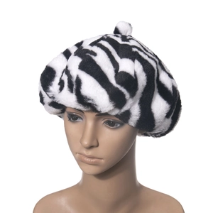 Close-up of zebra pattern plush beret featuring soft faux fur and fluffy top pom-pom