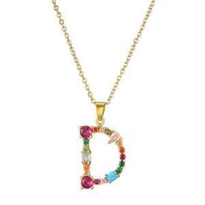 Macro shot of gold necklace with D-shaped pendant set with multicolored zircon stones