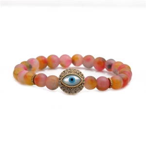 Close-up of 8mm matte colorful beaded bracelet featuring a zircon-studded Evil Eye charm