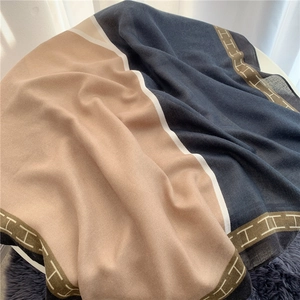 Chic color-block cotton linen shawl featuring a classic H pattern and soft fringe edges