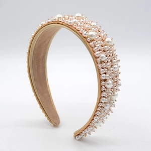 Detail view of Baroque velvet headband with white faux pearls and gold beads