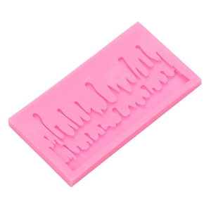 Pink silicone mold with icicle drip shapes for Christmas cake decorating and DIY resin art