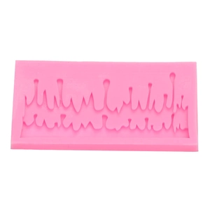 Detailed macro view of pink silicone mold featuring icicle and liquid drip textures