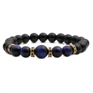 Tiger eye and matte black beaded bracelet with gold zircon spacers for men in top view