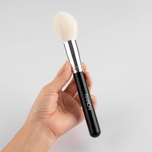 Large flame-shaped highlighter brush with soft bristles and professional black handle