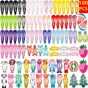 Flat lay of 100 piece colorful kids hair clips featuring stars animals and fruits