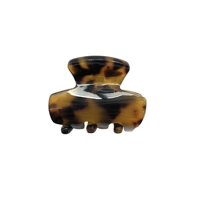 Small tortoiseshell acetate hair claw clip with leopard pattern for half-up hairstyles