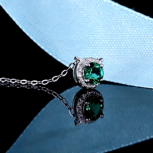 Elegant S925 sterling silver necklace with a brilliant round green moissanite halo pendant