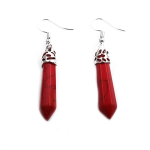 Elegant red stone cylinder drop earrings with decorative silver metal top on white background