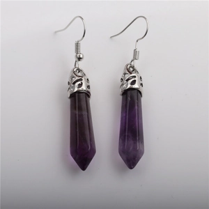 Detail of purple hexagonal crystal drop earrings with silver hollow flower metal caps