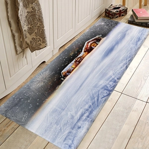 Detailed view of long flannel kitchen mat with a snowy winter cabin and firework scene