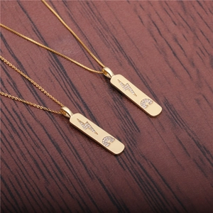 Golden box chain necklace with rectangular lightning bolt and crescent moon pendants