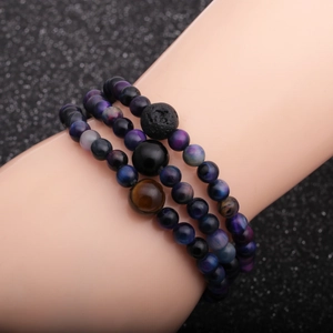 Three-piece beaded bracelet set featuring tiger eye, volcanic rock and galaxy stones