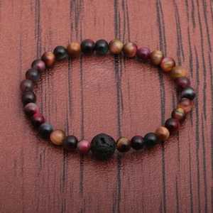 Mens beaded bracelet with multi-color tiger eye stones and a black volcanic lava rock focal bead