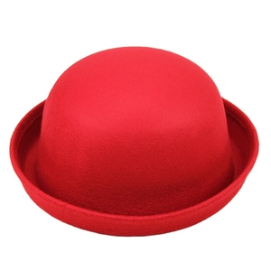 Classic bright red wool felt bowler hat with a rounded crown and turned-up brim for winter