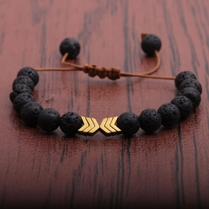Adjustable men's lava stone bracelet with golden arrow charm and woven brown cord