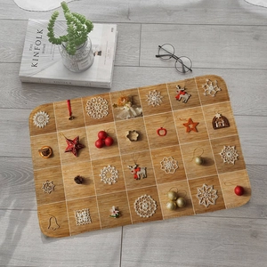 Christmas countdown wooden advent board with 24 festive ornaments on grey floor
