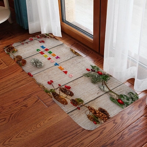 Christmas flannel absorbent mat with Merry Christmas text and pine cones on wood floor