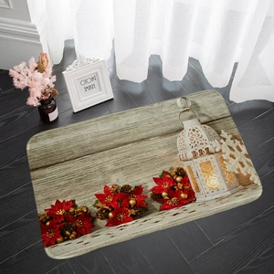Detailed view of Christmas floor mat with poinsettia and lantern on dark wood floor