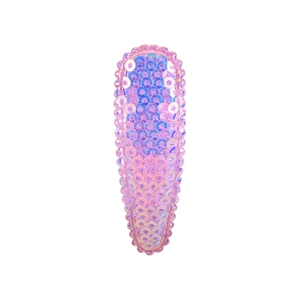 Detailed view of pink iridescent sequin BB clip with lace trim on a white background