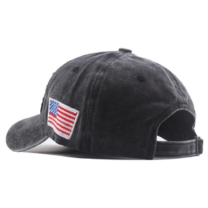Washed dark grey cotton baseball cap with American flag embroidery and adjustable strap
