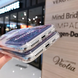 Detail view of iPhone case with purple liquid quicksand, butterflies, and precise cutouts