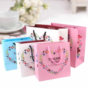 Floral heart Thank You gift bags in pink, white and blue colors with rope handles