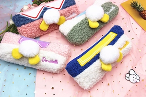 Detail of plush pencil case featuring soft faux fur texture and cute duck tail design