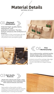 Detail of wooden jewelry display set featuring beige microfiber ring trays and neck forms