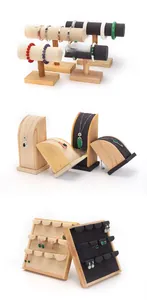 Detail of wooden jewelry display set featuring velvet necklace stands and bracelet T-bars