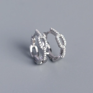 Detailed close-up of S925 sterling silver chain link hoop earrings with pavé crystals