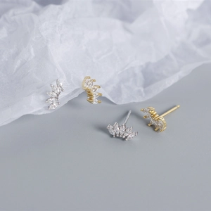 Macro shot of S925 silver stud earrings with marquise-cut zircon in fan-shaped design