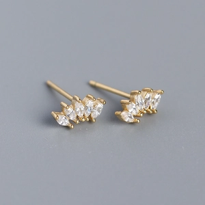 Macro detail of gold S925 silver stud earrings with marquise-cut marquise zircons