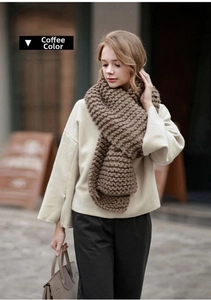 Close-up of thick coffee brown knit scarf showing chunky texture and warm woolen material