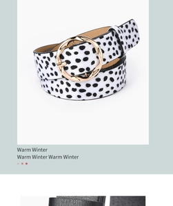Detail of dalmatian print leather belt featuring a golden twisted round buckle