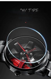Detailed macro view of car wheel rim watch face with a red brake caliper accent