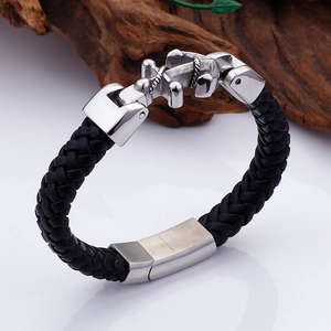 Black woven leather cord bracelet with 316L stainless steel anchor clasp on wood base