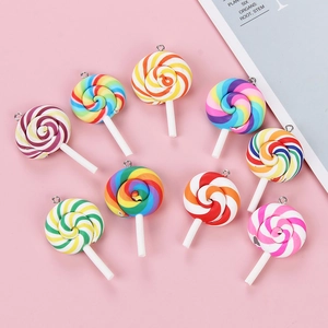 Detailed close-up of 9 colorful swirl lollipop charms with silver rings for DIY jewelry
