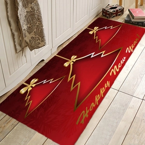Detailed view of a red flannel Christmas floor mat with festive trees on a wooden floor