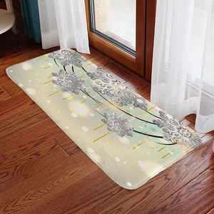 Detail of Christmas flannel rug with snowflake pattern on dark wood floor and soft lighting