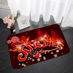 Detail of red Christmas flannel mat with gold patterns on dark wood floor
