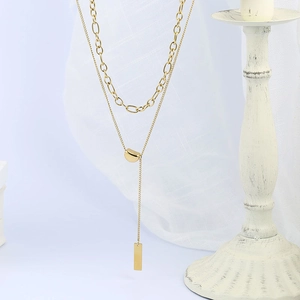 Minimalist double-layer gold titanium steel necklace with lucky bean pendants for women
