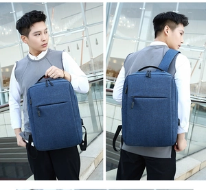 Blue waterproof laptop backpack for men shown in handheld and carrying scene