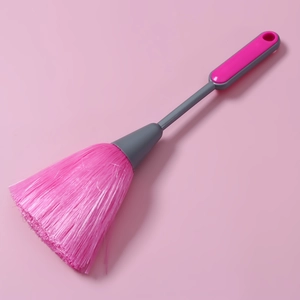 Detail view of pink PP soft bristles and grey anti-slip handle on keyboard dust brush