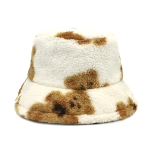 Close-up of soft brown cow print teddy fleece material on winter bucket hat
