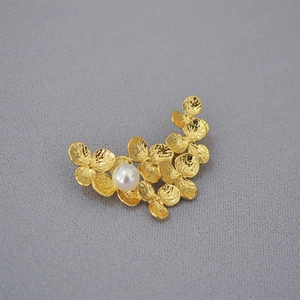 Elegant gold leaf flower brooch with white pearl inlay and hammer texture finish