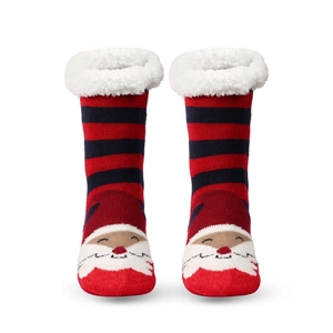 Detail of striped Christmas socks with Santa Claus pattern and fuzzy fleece cuffs