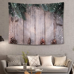 Detailed view of a Christmas pine tapestry hanging in a cozy living room setup