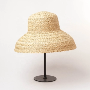 Elegant French style wide brim straw sun hat for women in natural raffia wood color
